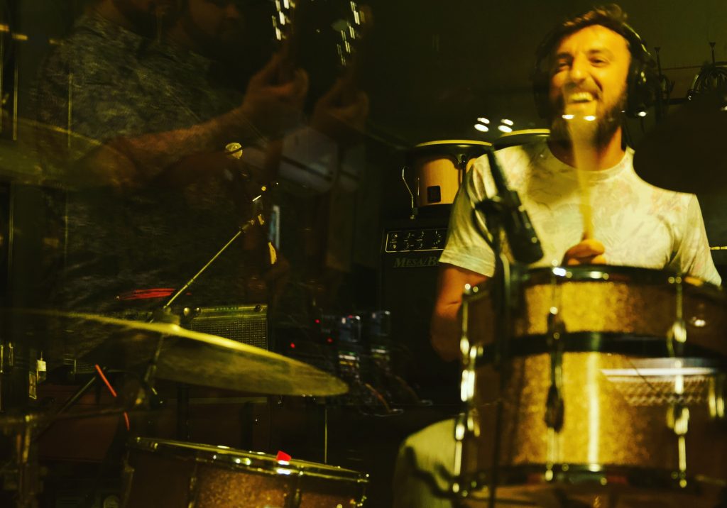 Lucas playing the drums.