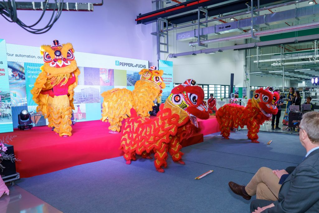 Ceremony in Vietnam: The "Grand Opening" for the new building in Vietnam begins with a traditional "Lion Dance".