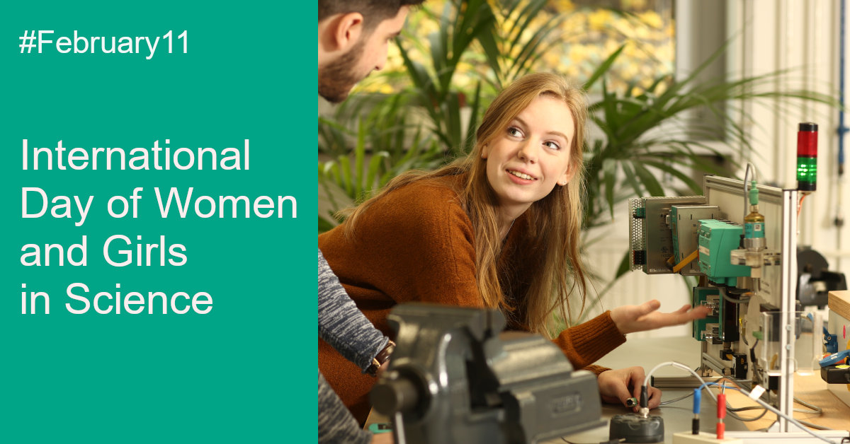 Women in science. On the left half of the picture, "International Day of Women and Girls in Science" is written on a green background. To the right is a woman at her workplace. In front of her you can see various devices she is working with.