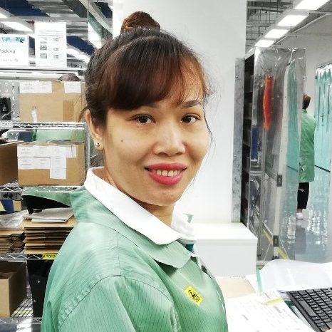 Pham Thi Diep Thuy is Production Operator at Pepperl+Fuchs Vietnam. Here she is sitting at her workplace.