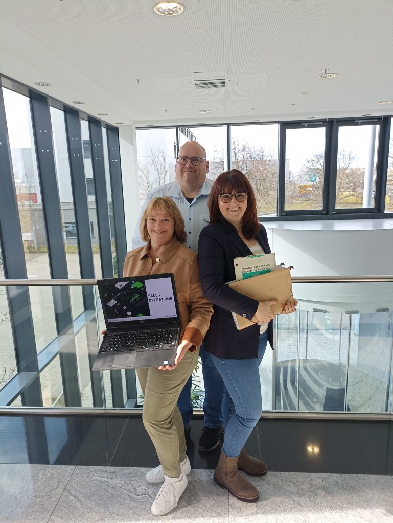 International Women's Day 2025: Group photo of Frank, Gaby and Angelika.