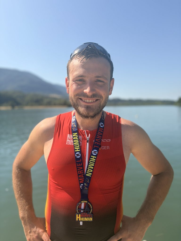 Profile picture of Marco in his training gear, with a lake blurred in the background.